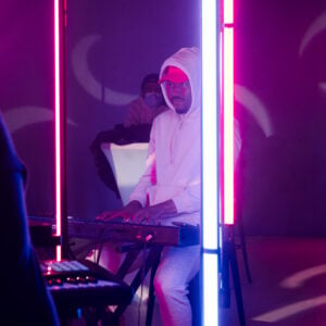 High-quality sound system setup with speakers, mixer, and microphones arranged for a live music or DJ event.