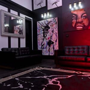 Art and music fusion lounge with live-performance ambiance, bold wall art, and modern lighting — blending creativity, rhythm, and culture in one space.